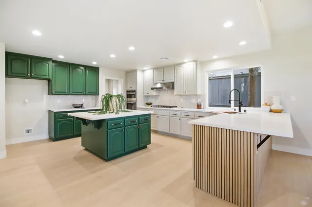 a very nice looking dining room with a table and chairs