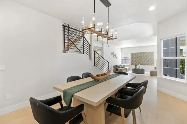 a kitchen with sink cabinets and wooden floor