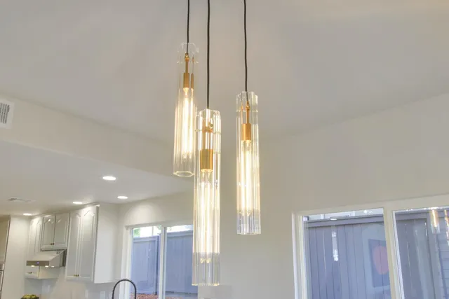 a bathroom with a double vanity sink mirror and bathtub