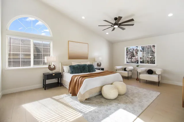 a view of a backyard with a garden and entertaining space