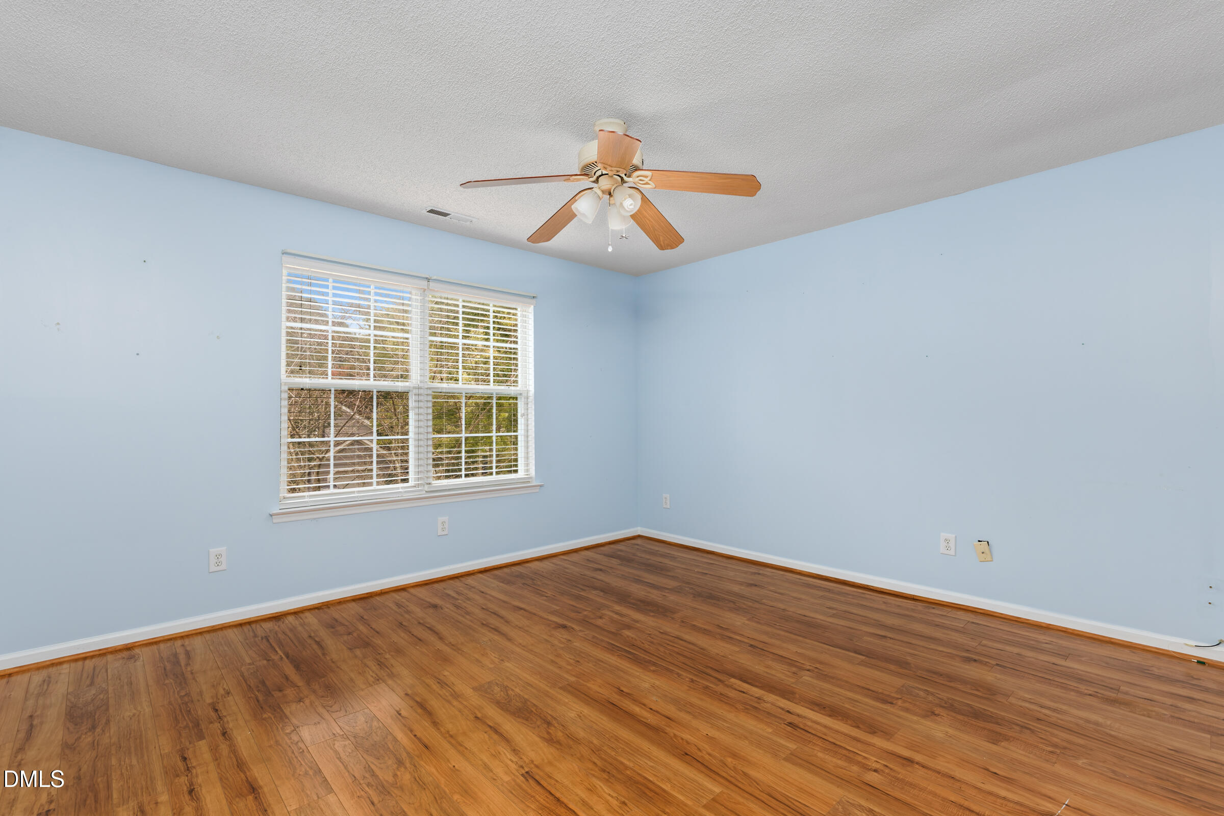 6 Tinsbury Place Durham, NC 27713 - Photo 20 of 30 a view of an empty room with wooden floor and a window