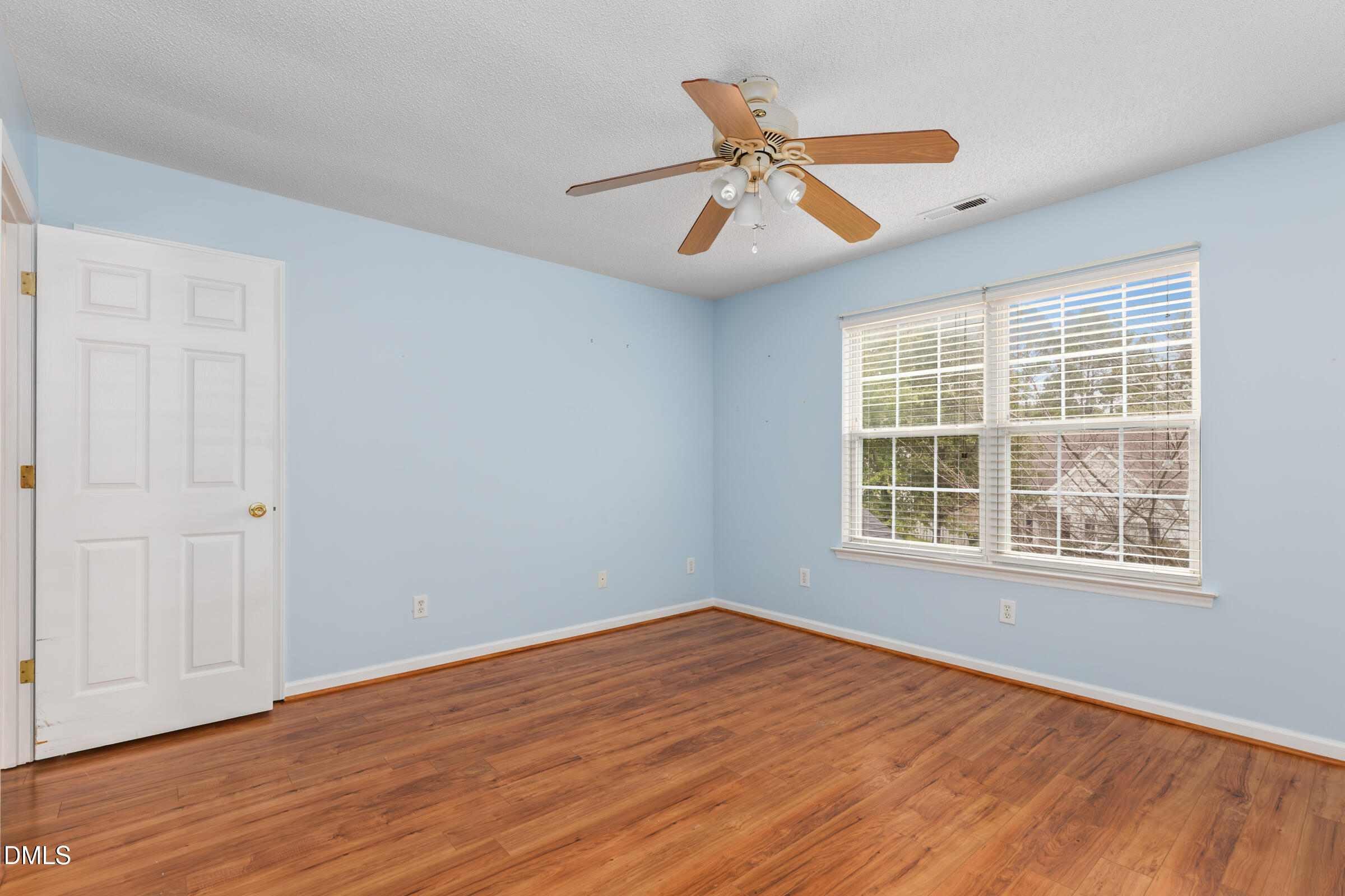 6 Tinsbury Place Durham, NC 27713 - Photo 21 of 30 a view of an empty room with wooden floor and a window