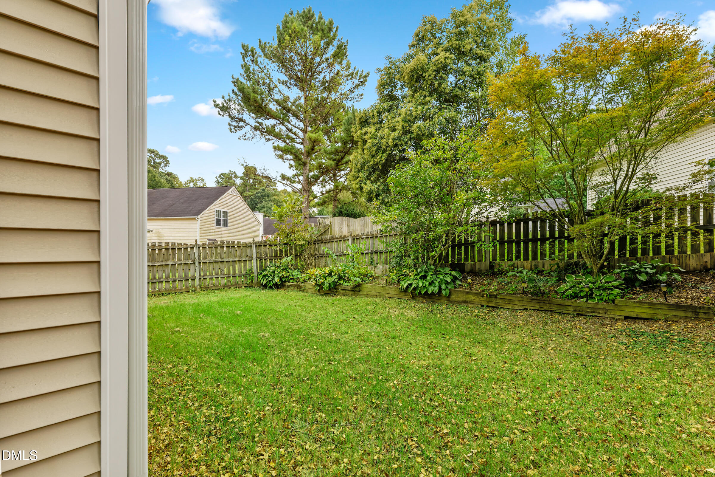 6 Tinsbury Place Durham, NC 27713 - Photo 25 of 30 a view of backyard with garden and deck