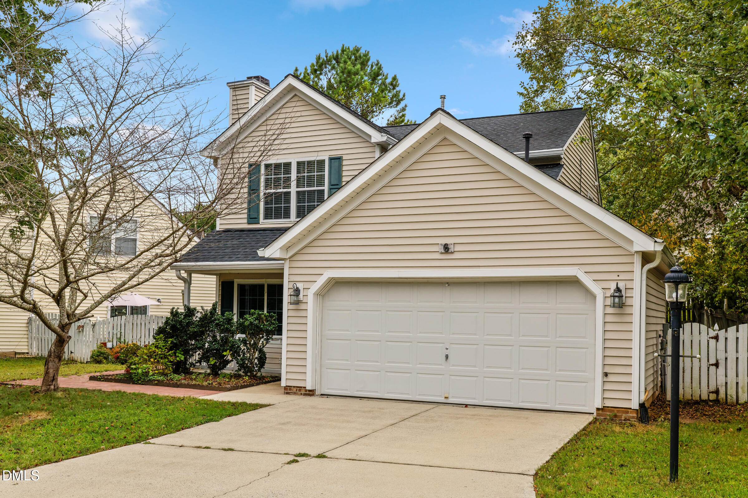 6 Tinsbury Place Durham, NC 27713 - Photo 2 of 30 a view of house with a yard and potted plants