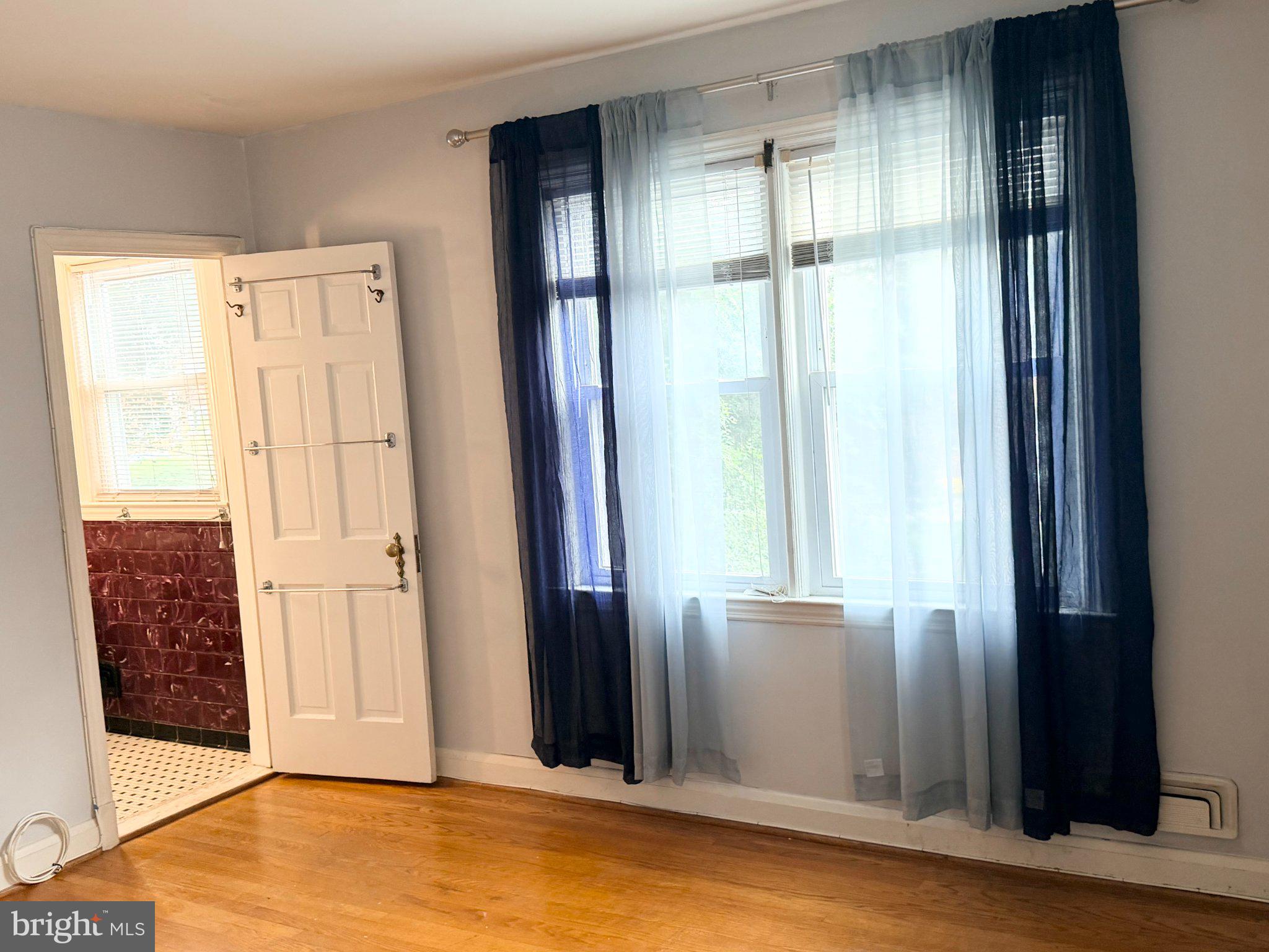 1615 Burnwood Road Baltimore, MD 21239 - Photo 13 of 83 Bright and airy room with elegant drapes.