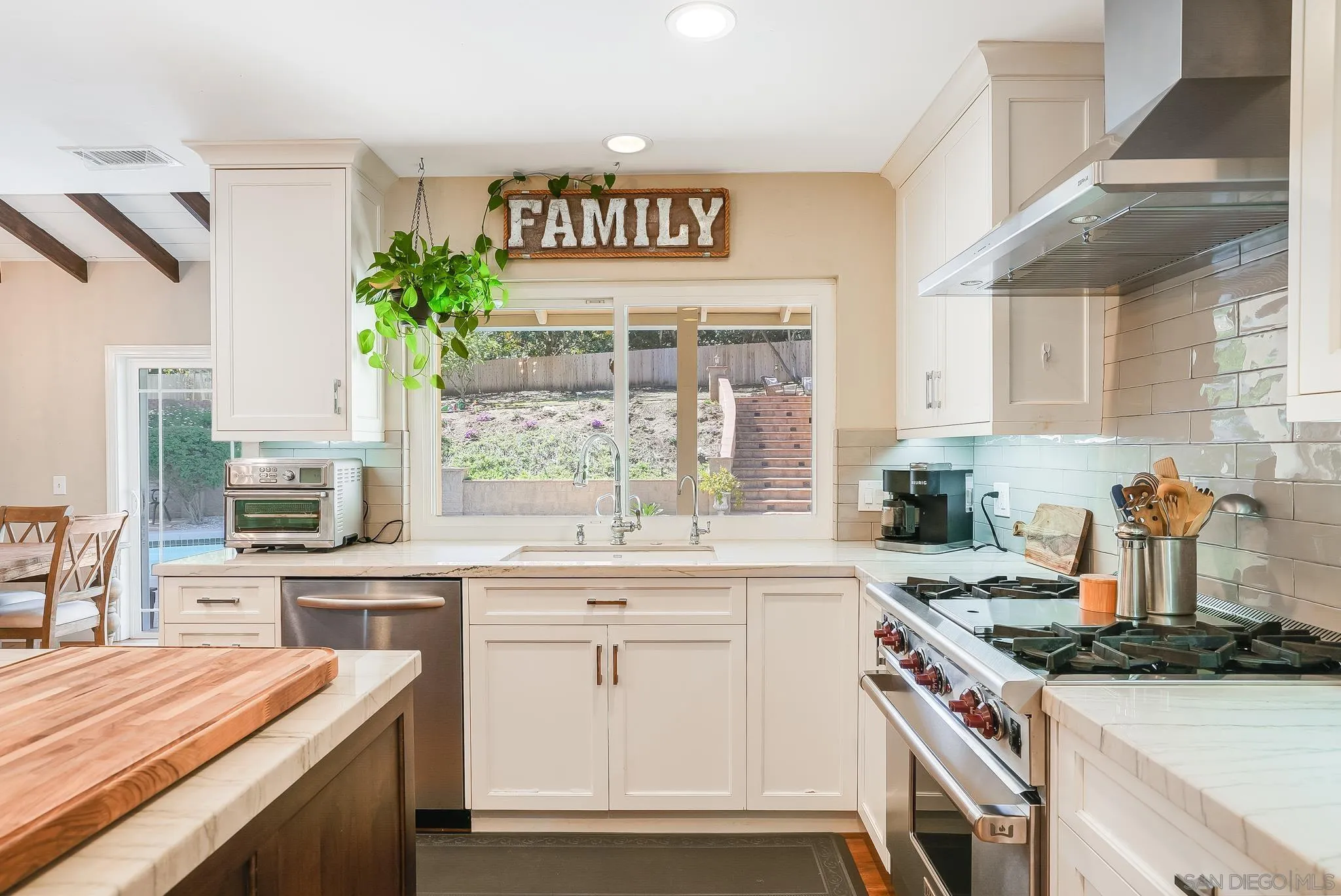 13611 Rostrata Road Poway, CA 92064 - Photo 28 of 67 a kitchen with a sink stove and cabinets