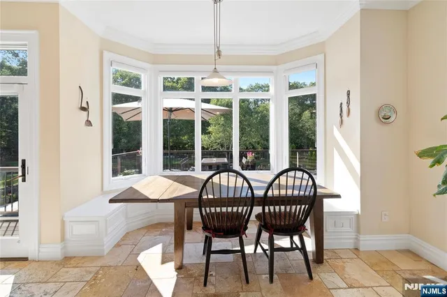 a view of a dining room with furniture window and outside view