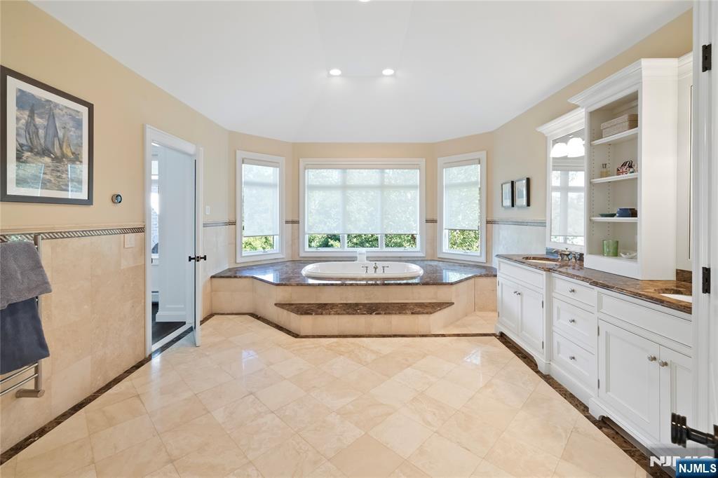 417 Rte 9W Alpine, NJ 07620 - Photo 21 of 50 a spacious bedroom with a large bed and a large window