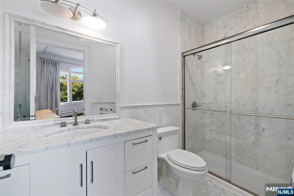 417 Rte 9W Alpine, NJ 07620 - Photo 26 of 50 a bathroom with a sink a toilet and shower