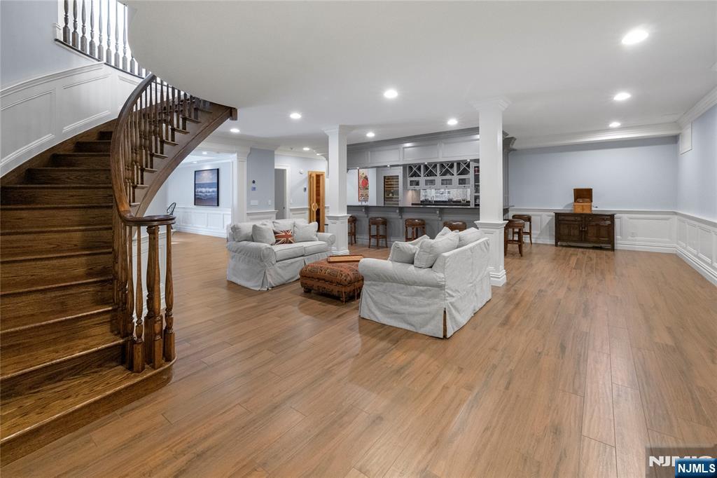 417 Rte 9W Alpine, NJ 07620 - Photo 28 of 50 a living room with furniture and a wooden floor