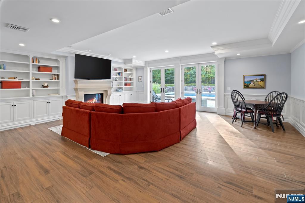 417 Rte 9W Alpine, NJ 07620 - Photo 29 of 50 a living room with furniture and a flat screen tv