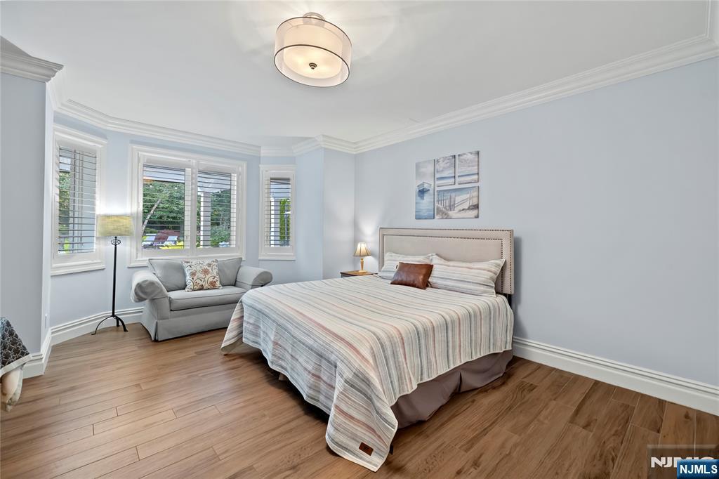 417 Rte 9W Alpine, NJ 07620 - Photo 35 of 50 a bedroom with a large bed and a large window