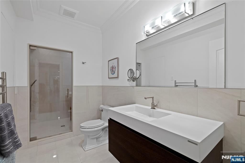 417 Rte 9W Alpine, NJ 07620 - Photo 36 of 50 a bathroom with a sink a toilet and shower