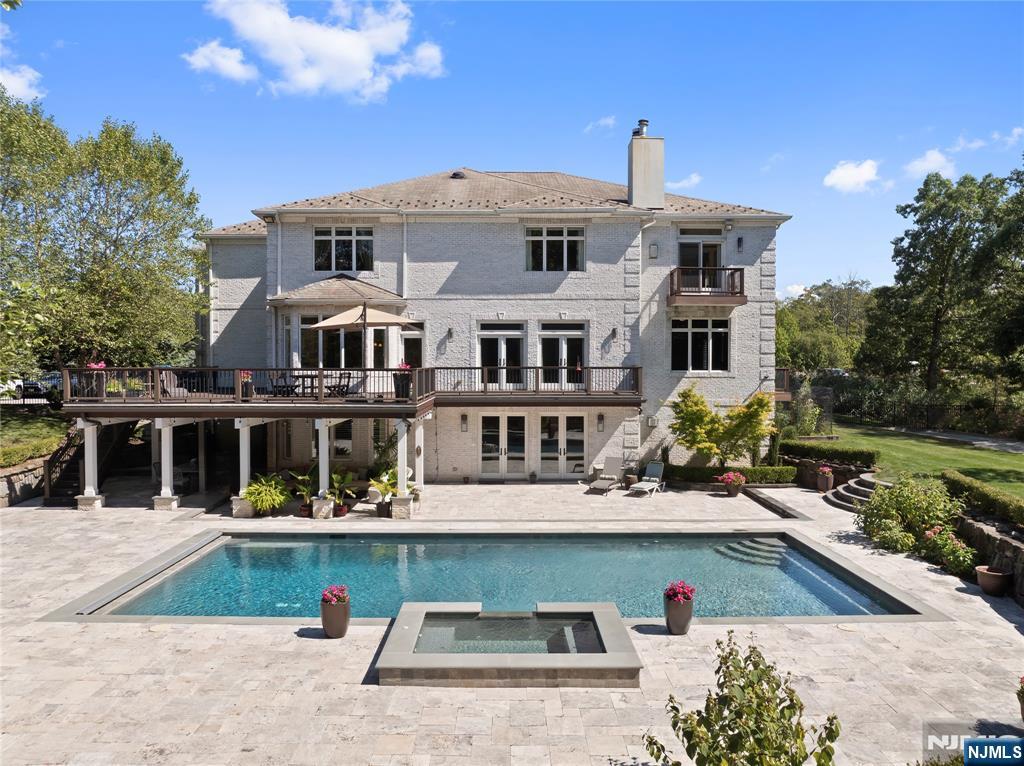 417 Rte 9W Alpine, NJ 07620 - Photo 40 of 50 a front view of a house with a yard