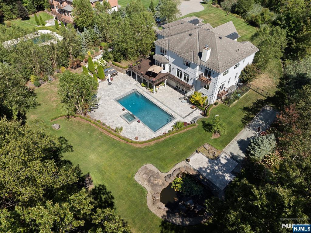 417 Rte 9W Alpine, NJ 07620 - Photo 47 of 50 an aerial view of a house with a yard and swimming pool