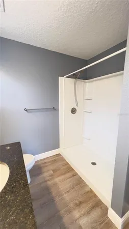 a bathroom with a shower and a tub