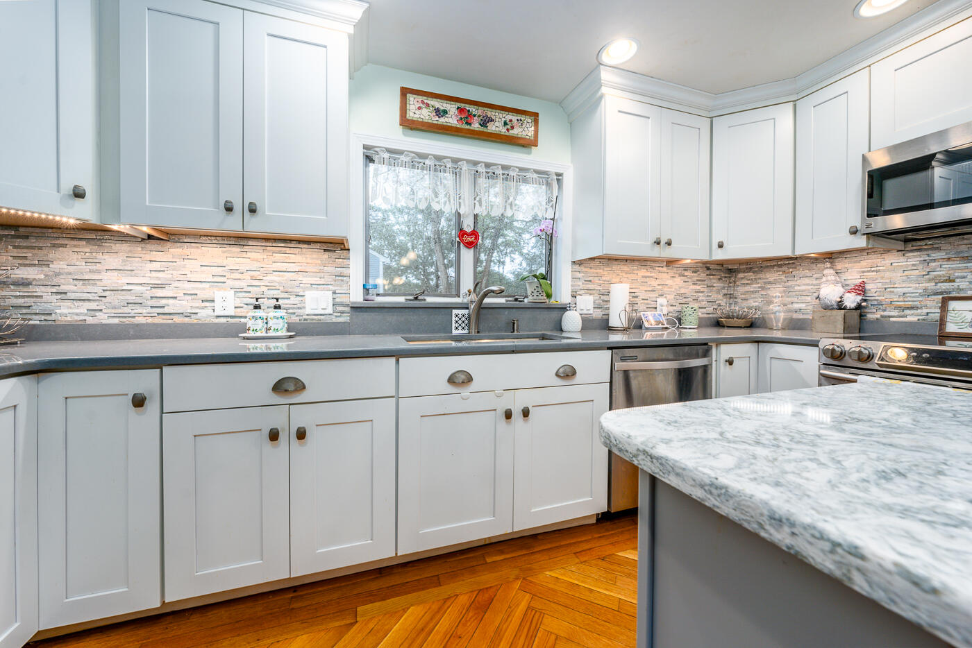 23 Redwood Circle Mashpee, MA 02649 - Photo 12 of 40 a kitchen with granite countertop a sink and cabinets