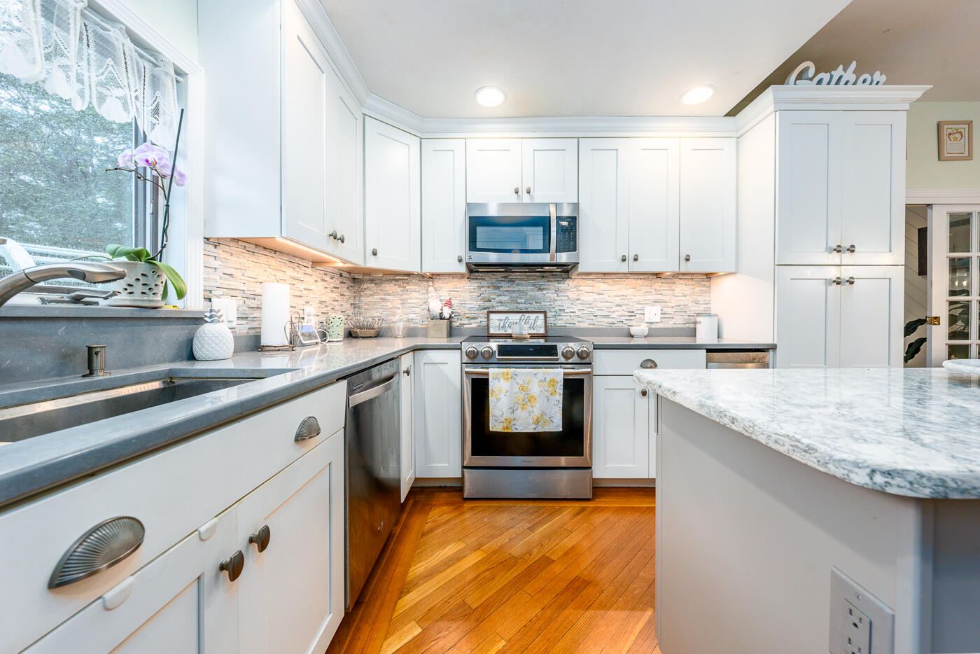 23 Redwood Circle Mashpee, MA 02649 - Photo 13 of 40 a kitchen with granite countertop white cabinets and white appliances