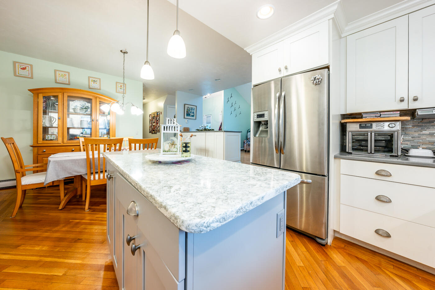 23 Redwood Circle Mashpee, MA 02649 - Photo 15 of 40 a kitchen with stainless steel appliances granite countertop a table chairs refrigerator and sink