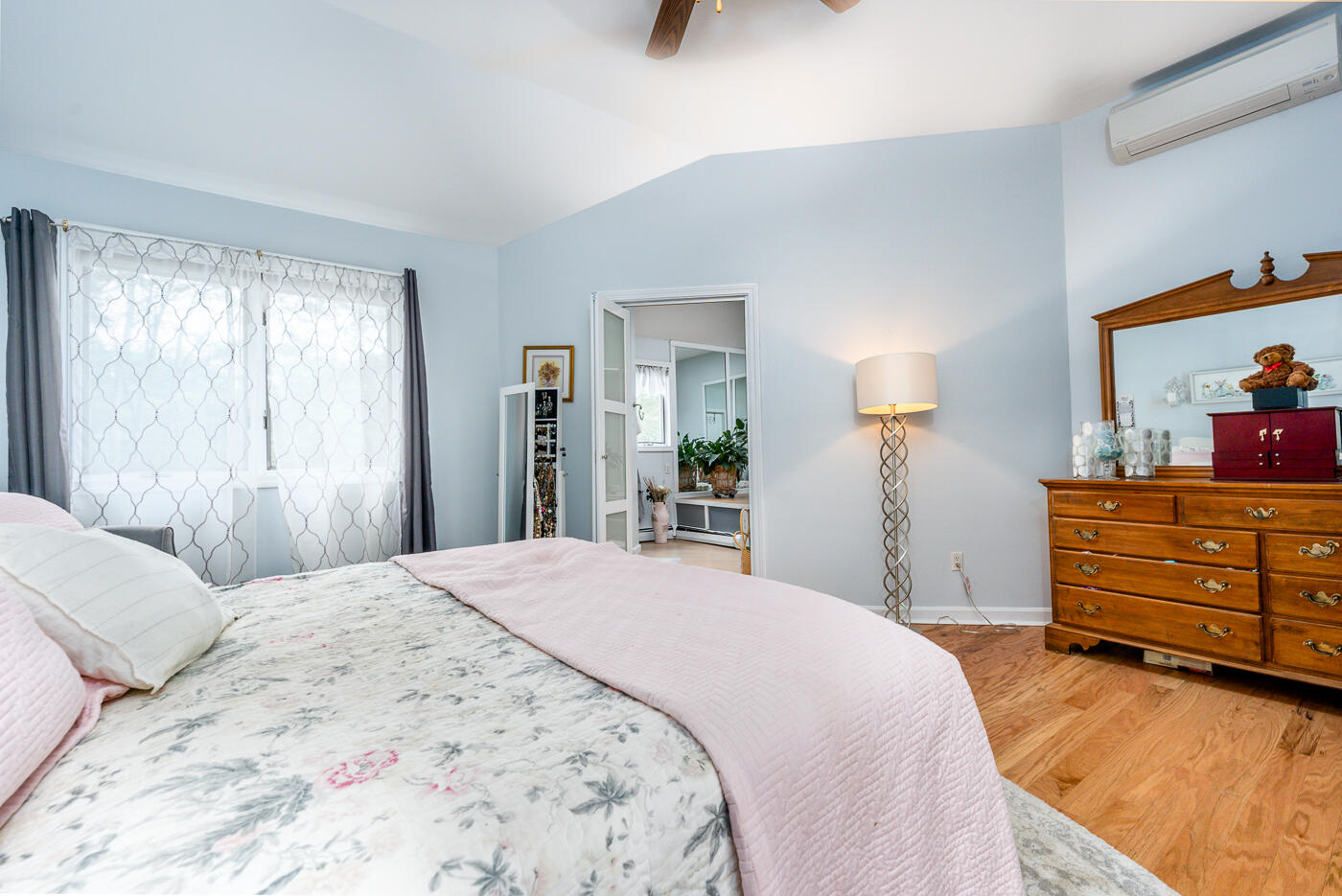 23 Redwood Circle Mashpee, MA 02649 - Photo 23 of 40 a bedroom with a bed and a dresser