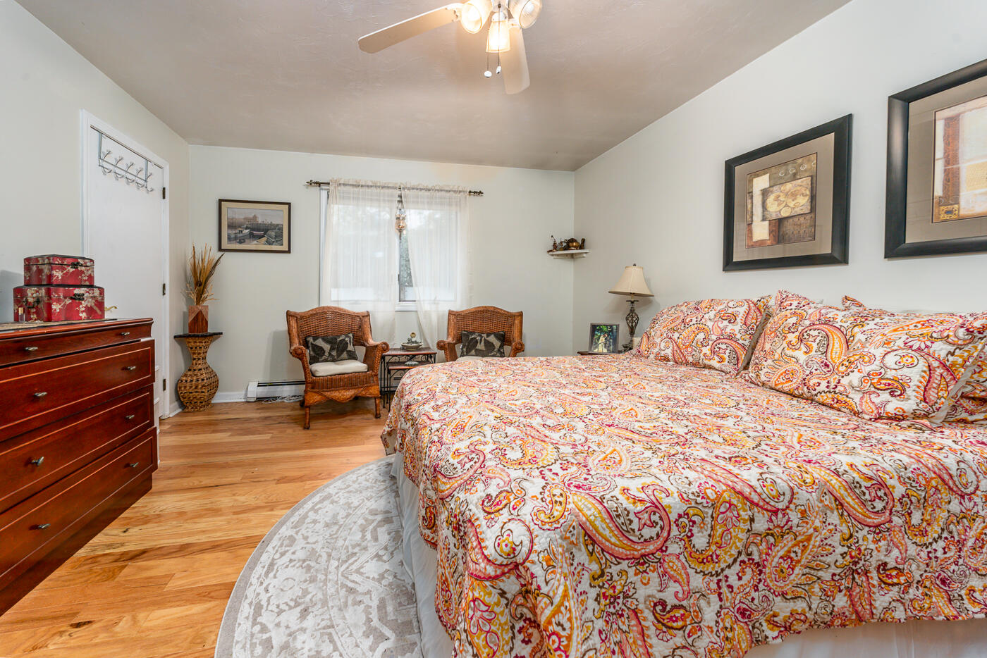 23 Redwood Circle Mashpee, MA 02649 - Photo 28 of 40 a bedroom with a bed and wooden floor