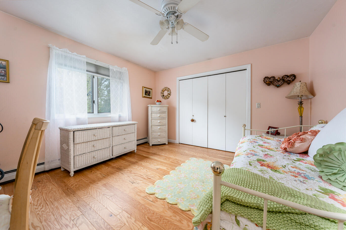 23 Redwood Circle Mashpee, MA 02649 - Photo 29 of 40 a bedroom with a bed and a chandelier