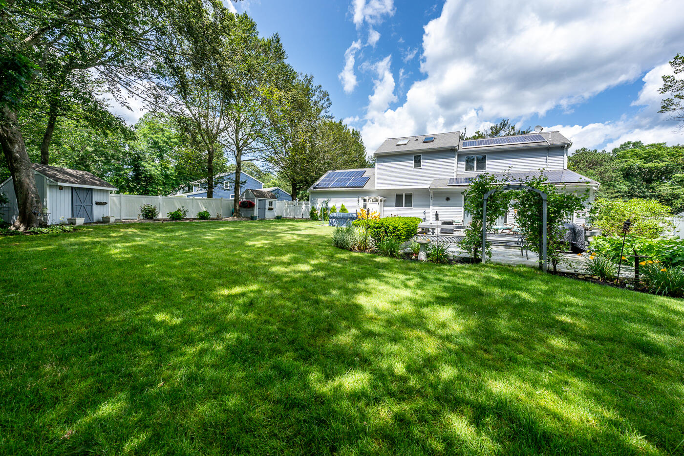 23 Redwood Circle Mashpee, MA 02649 - Photo 32 of 40 a front view of a house with a garden