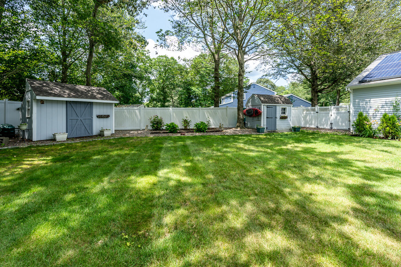 23 Redwood Circle Mashpee, MA 02649 - Photo 34 of 40 a house with a tree in front of it