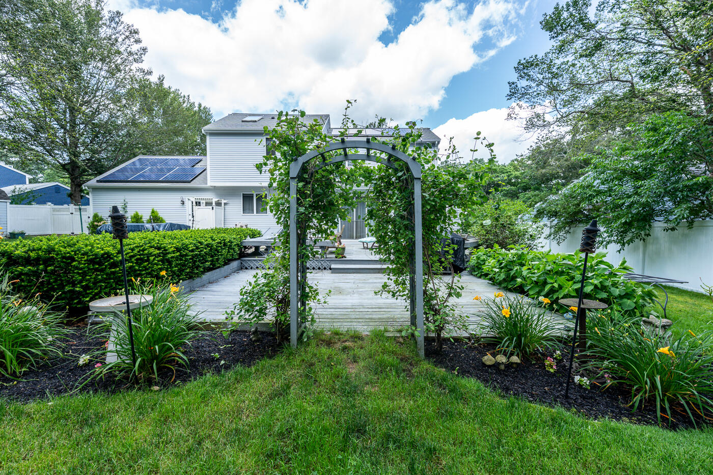 23 Redwood Circle Mashpee, MA 02649 - Photo 40 of 40 a view of a house with a yard and potted plants