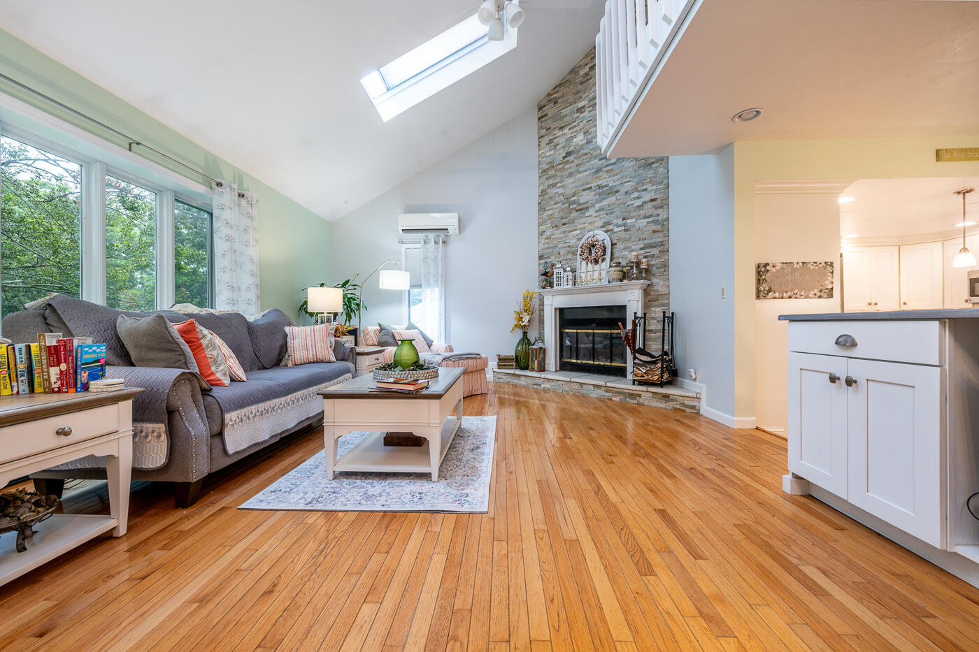 23 Redwood Circle Mashpee, MA 02649 - Photo 7 of 40 a living room with furniture and a fireplace