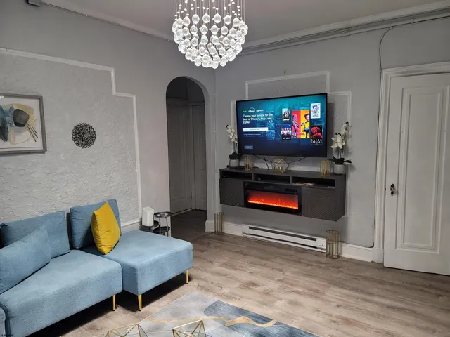 a living room with furniture and a flat screen tv