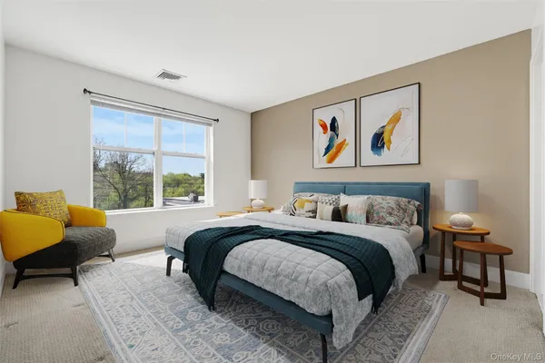 a bedroom with a bed and a couch