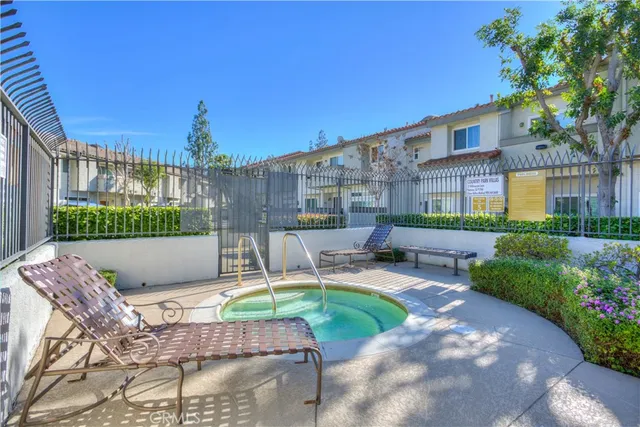a view of a swimming pool with a yard
