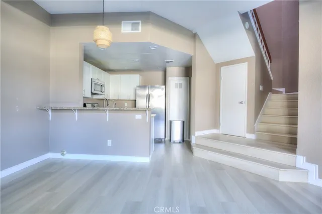 a view of kitchen and wooden floor