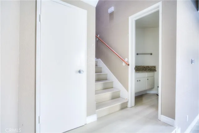 a view of entryway and hall with a hallway