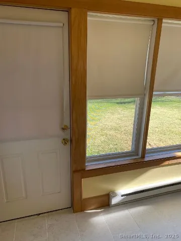 a view of a room with a large window