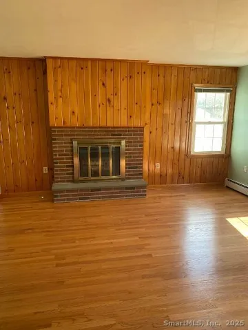 a view of a livingroom with wooden floor