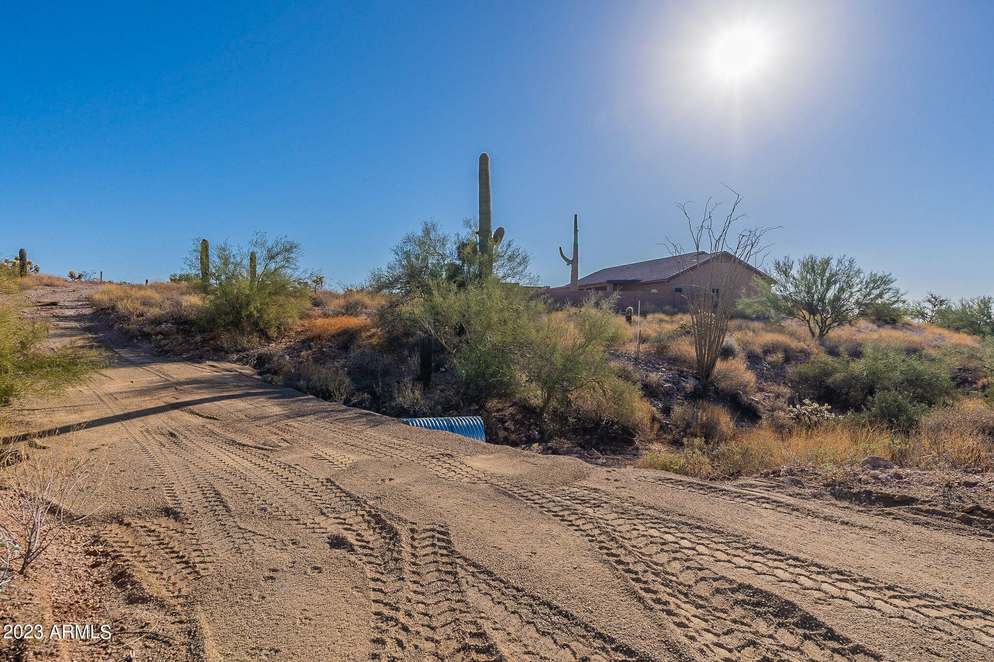 0 North Idaho Road Apache Junction, AZ 85119 - Photo 13 of 24 a view of a dry yard with wooden fence