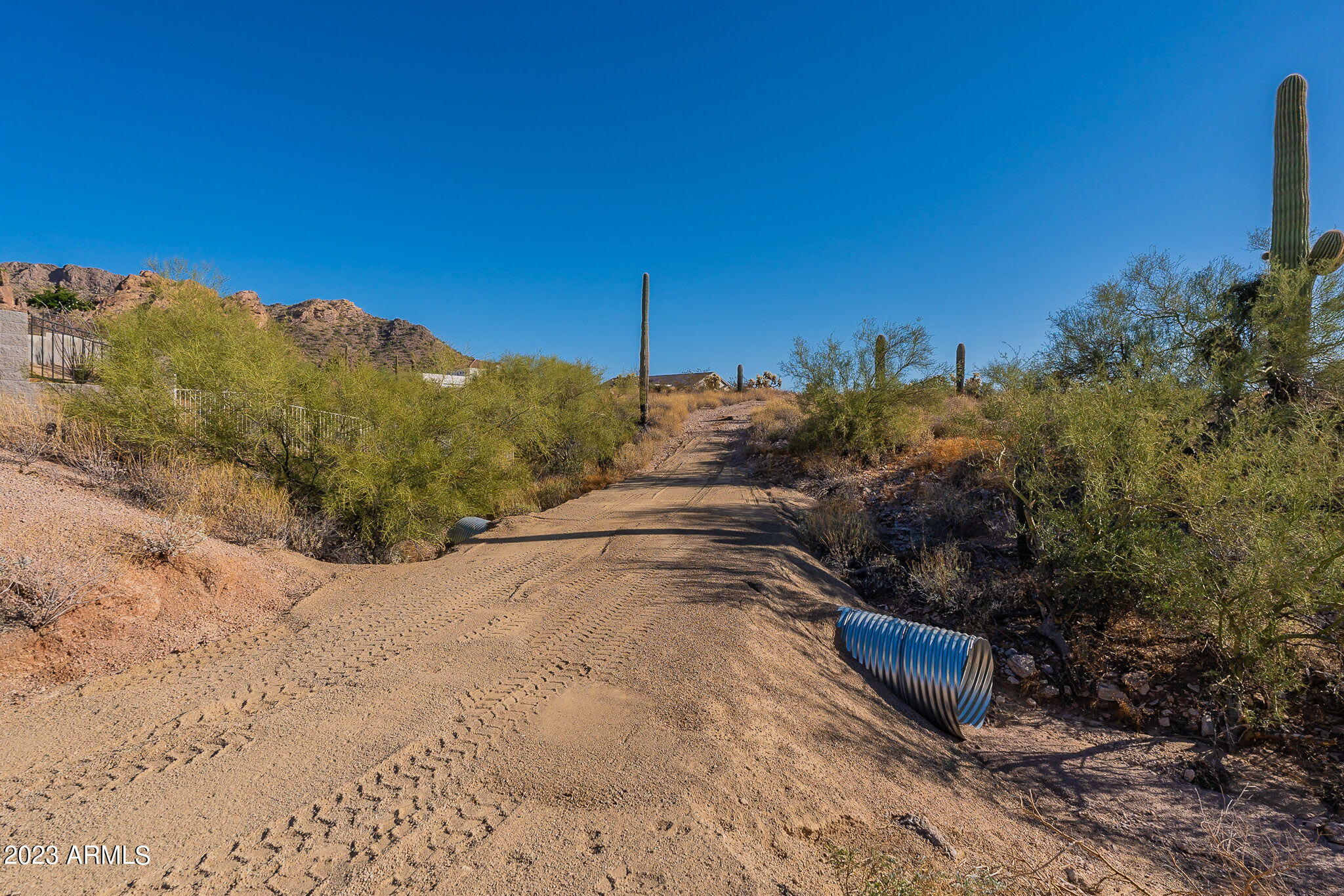 0 North Idaho Road Apache Junction, AZ 85119 - Photo 14 of 24 a view of a dry yard with a house