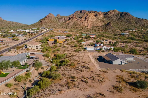 an aerial view of a residential houses with outdoor space