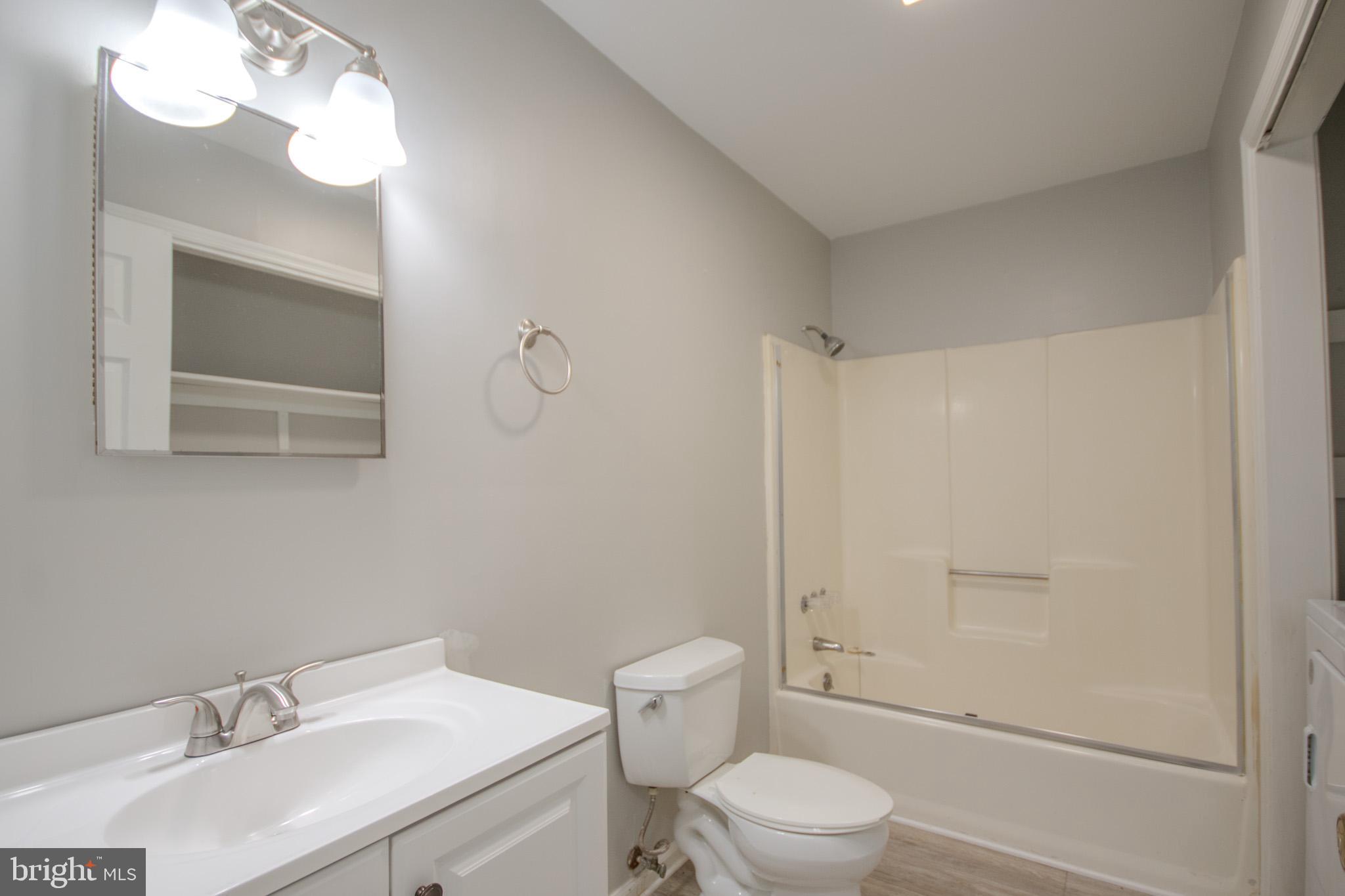 103 Ocean Parkway Ocean Pines, MD 21811 - Photo 14 of 44 a bathroom with a sink toilet vanity and shower