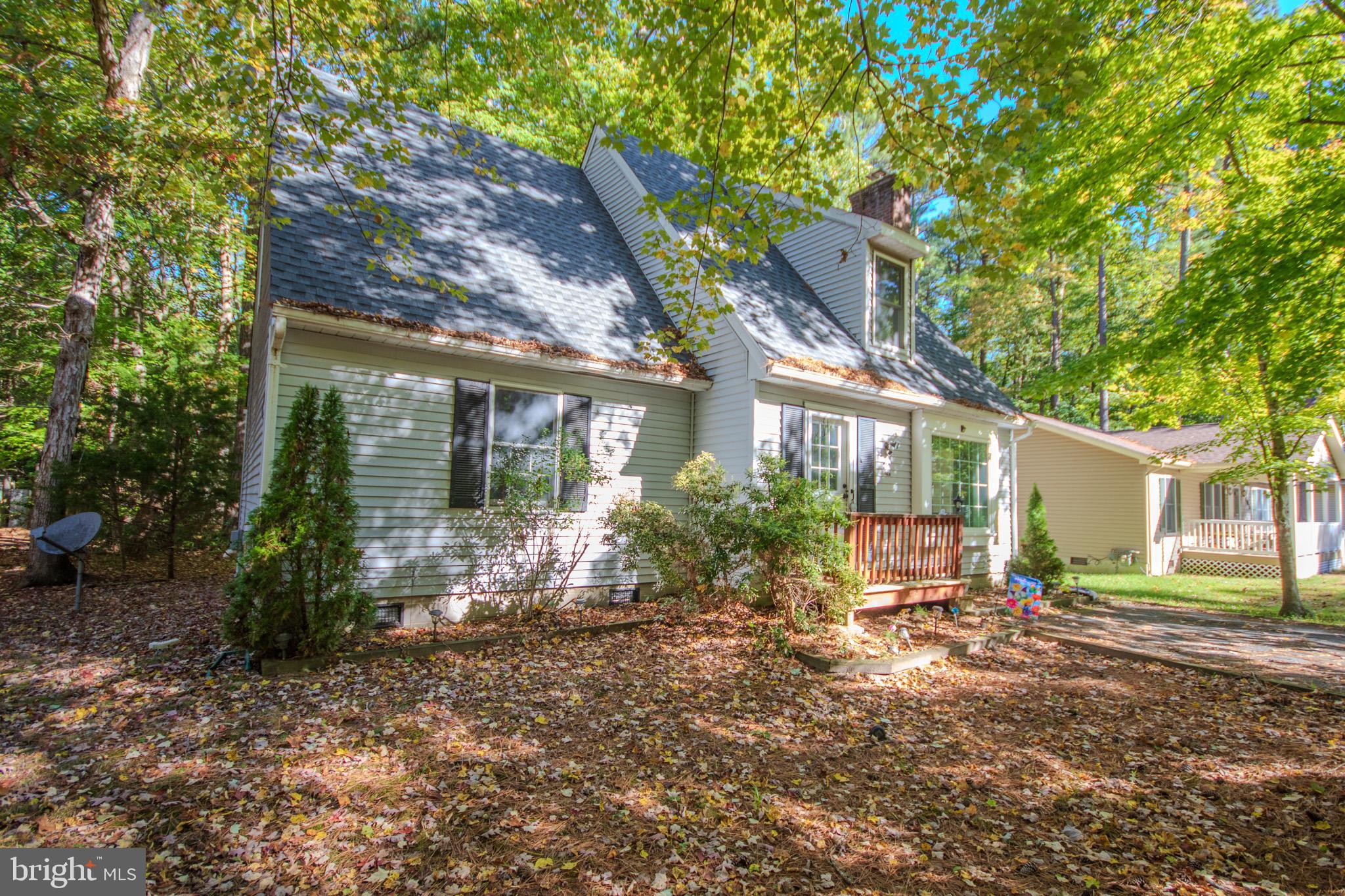 103 Ocean Parkway Ocean Pines, MD 21811 - Photo 2 of 44 a front view of a house with garden