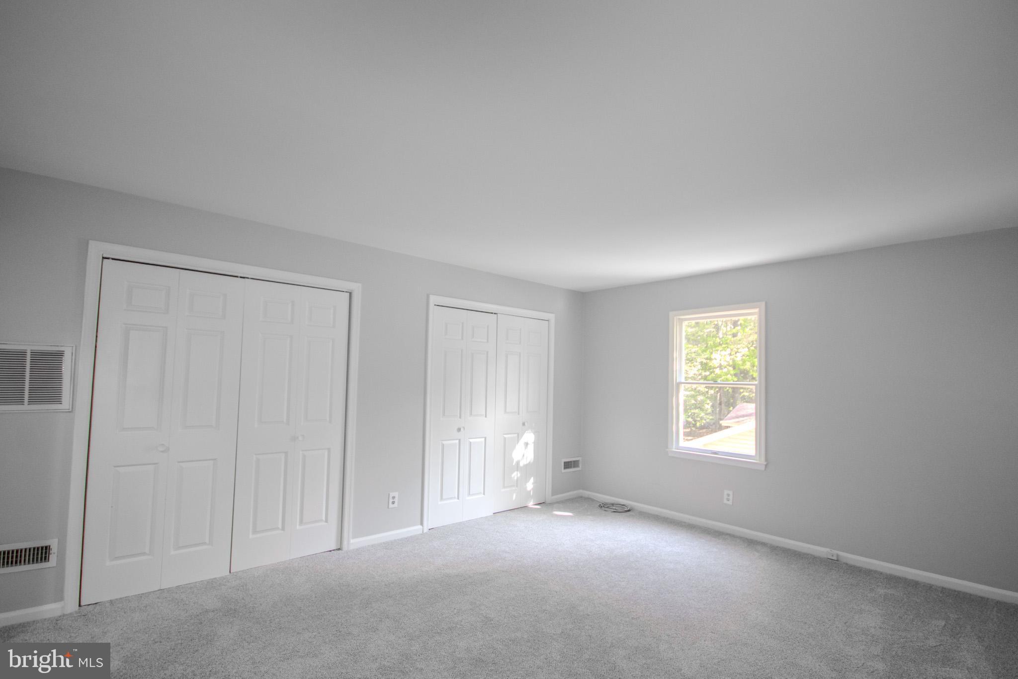 103 Ocean Parkway Ocean Pines, MD 21811 - Photo 21 of 44 an empty room with windows