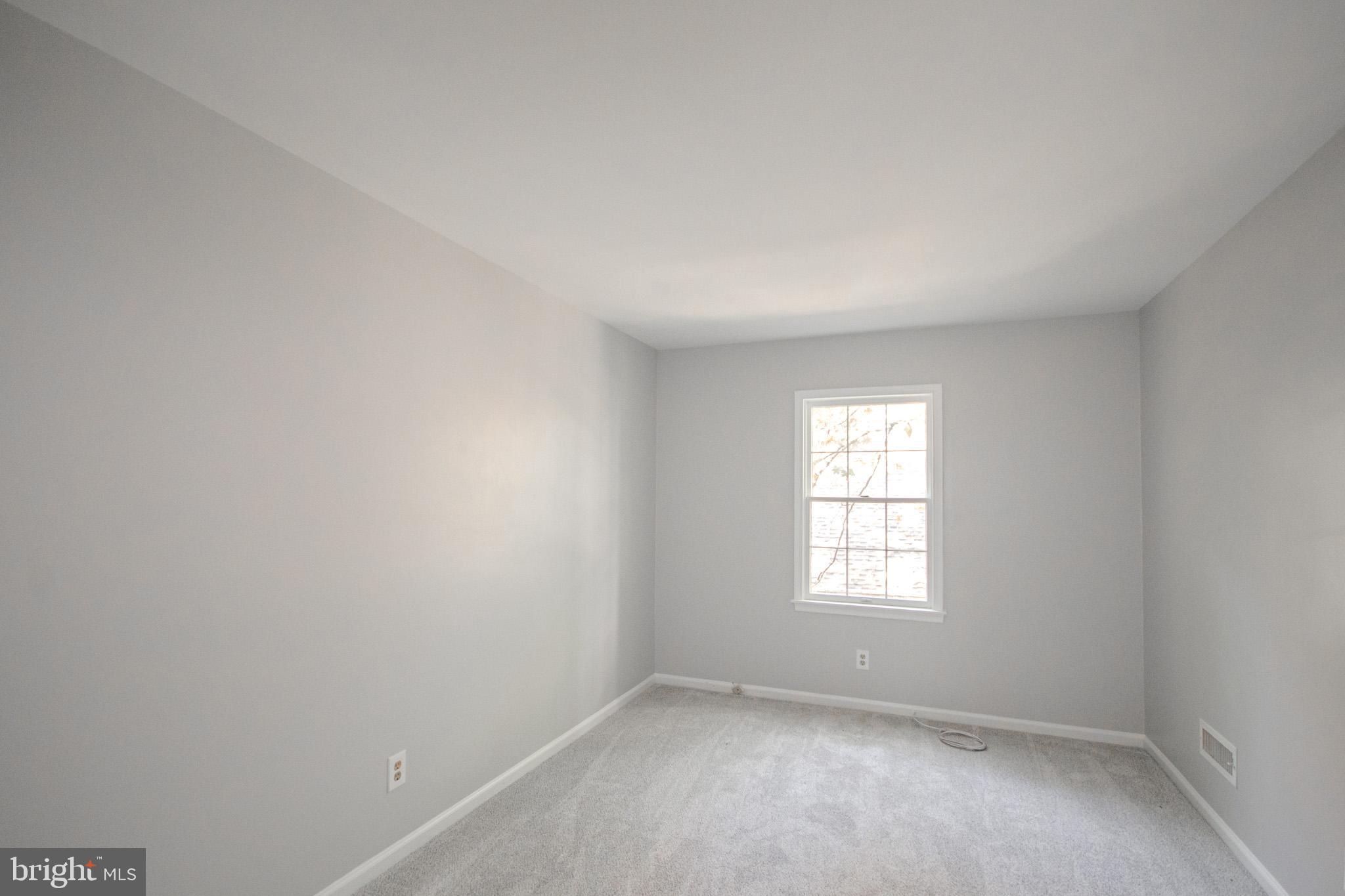 103 Ocean Parkway Ocean Pines, MD 21811 - Photo 24 of 44 an empty room with a window