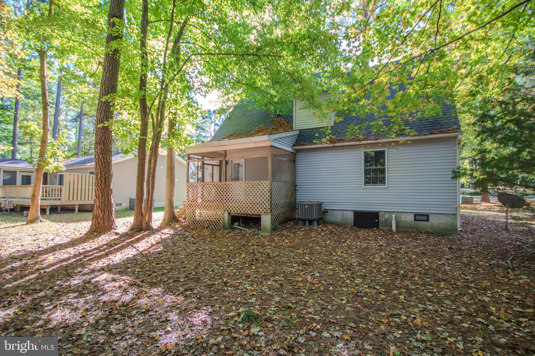 103 Ocean Parkway Ocean Pines, MD 21811 - Photo 30 of 44 a house view with a backyard space
