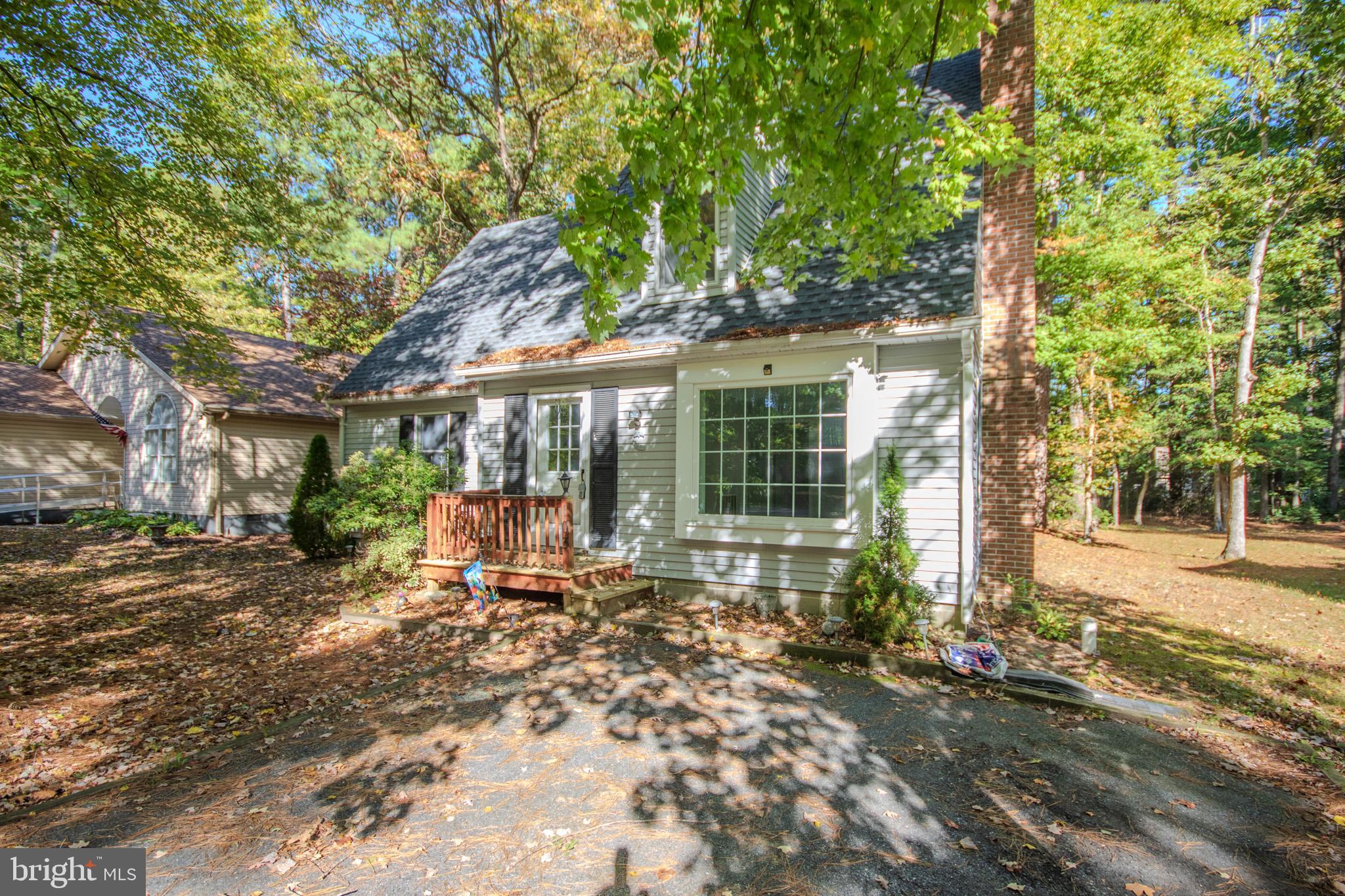 103 Ocean Parkway Ocean Pines, MD 21811 - Photo 3 of 44 a view of a house with a large tree