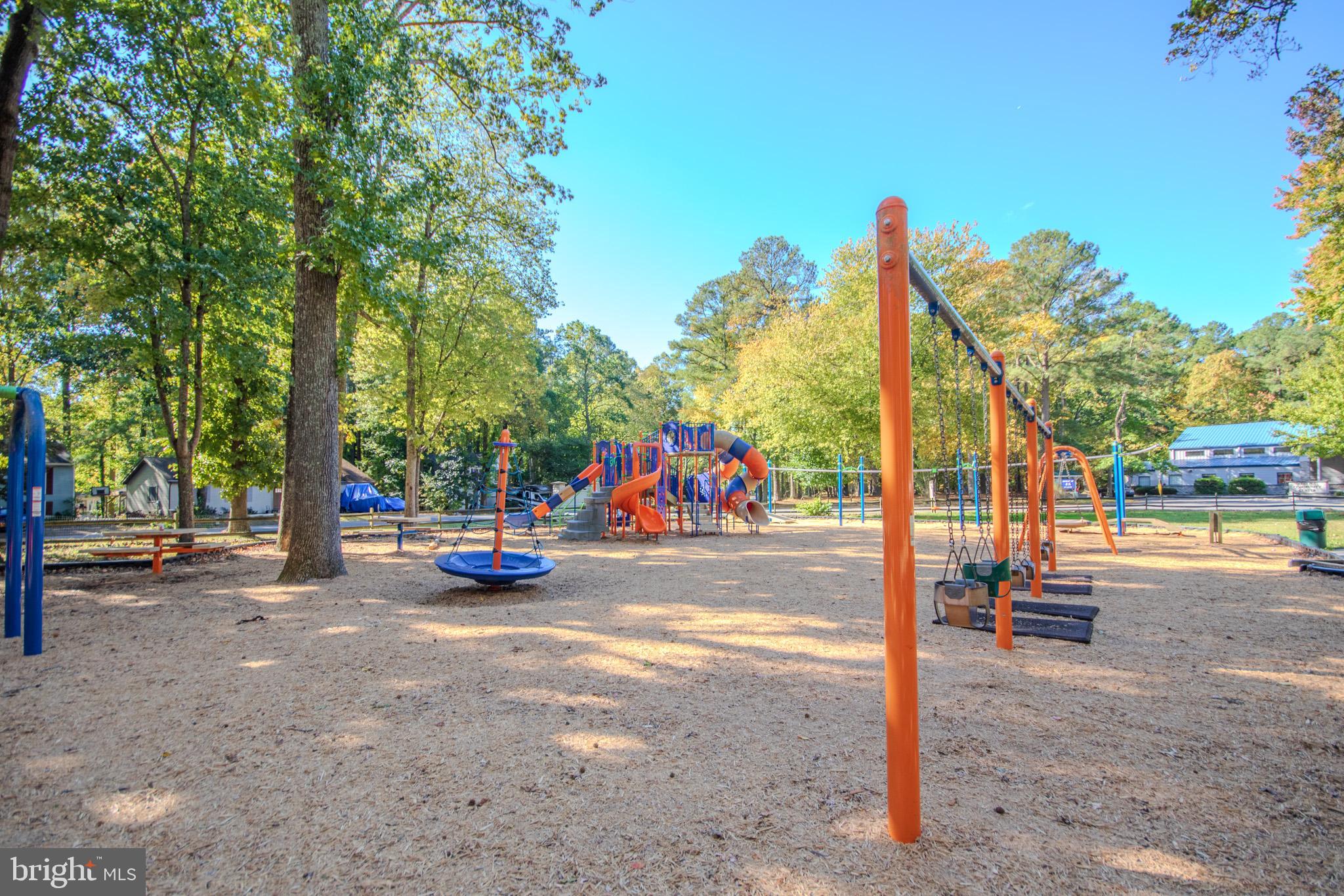 103 Ocean Parkway Ocean Pines, MD 21811 - Photo 38 of 44 a view of a street with cars parked