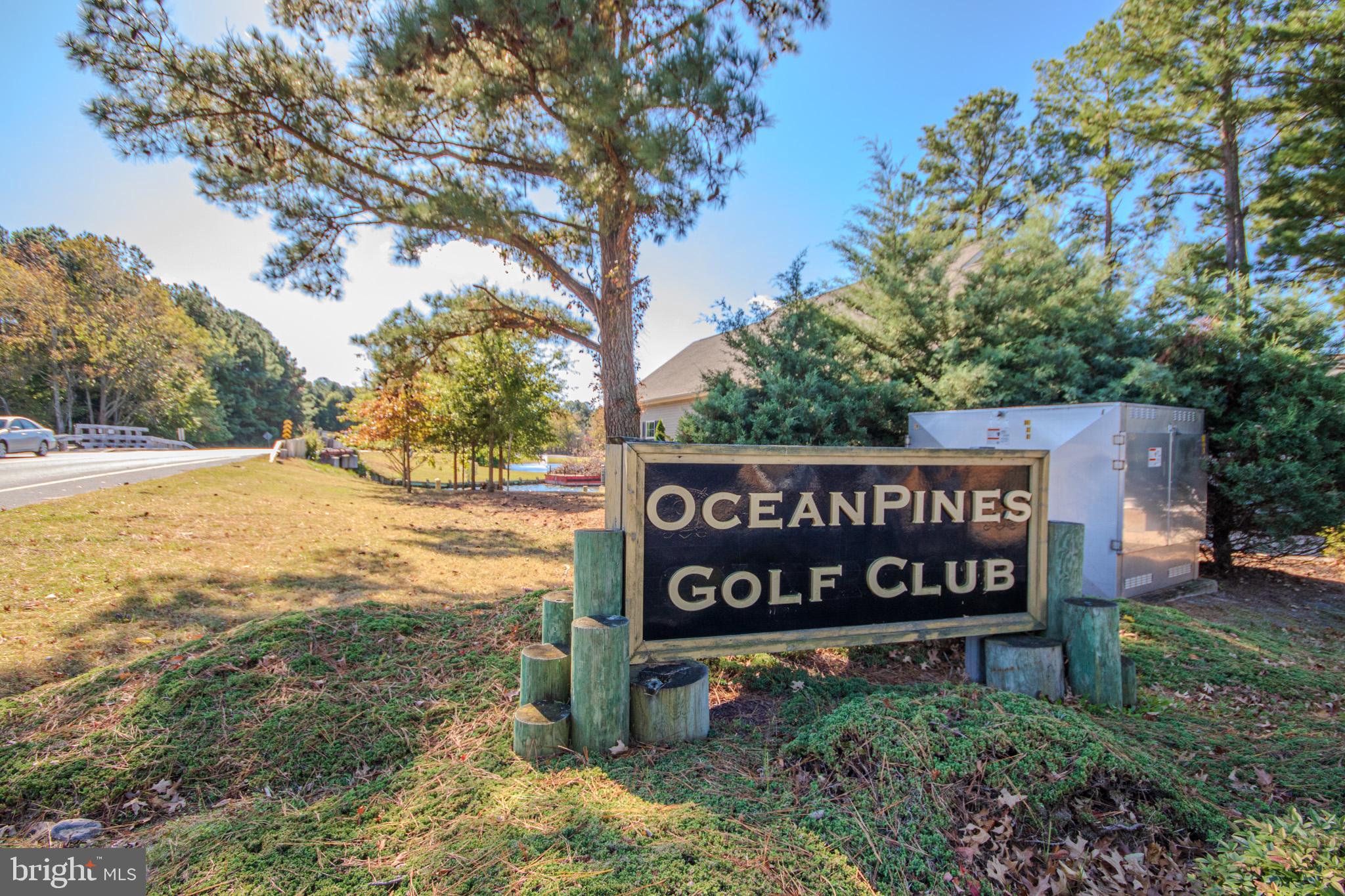 103 Ocean Parkway Ocean Pines, MD 21811 - Photo 43 of 44 a sign broad in front of flowers