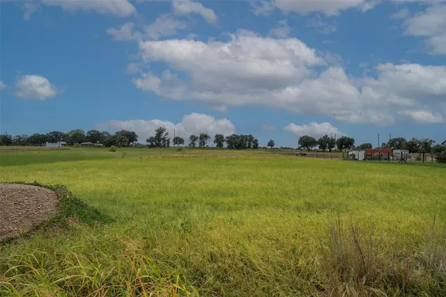 a view of a lake with houses in the back