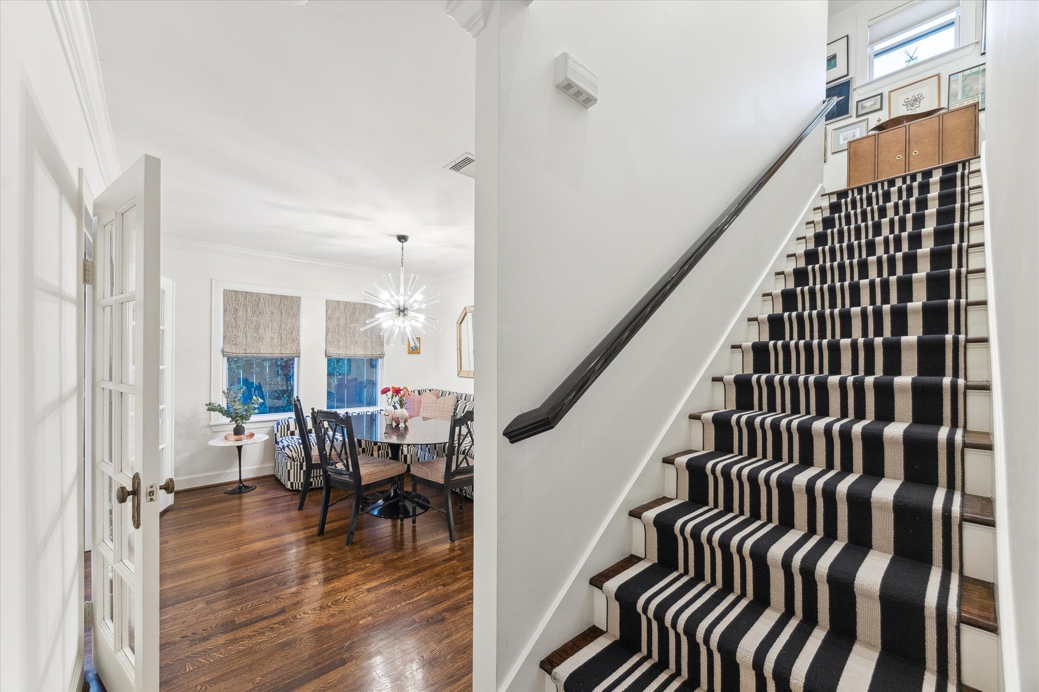 2124 Sul Ross Street Houston, TX 77098 - Photo 18 of 36 Staircase with custom runner and Farrow and Ball painted bannister leads you to the Primary Suite on the second floor.